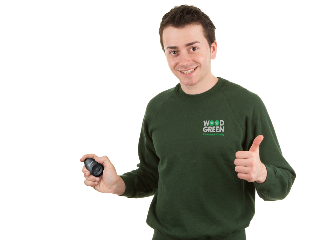 man in green jumper holding mysos