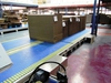 heavy duty modular flat belt transports stacked corrugated cardboard